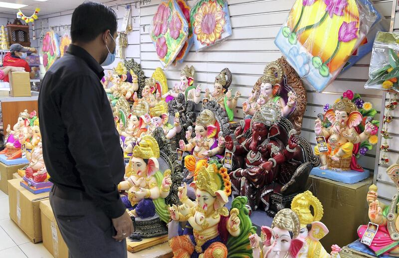 DUBAI, UNITED ARAB EMIRATES , August 17 – 2020 :- Colourful Ganesh statues made by plaster of paris on display at the Madhoor store in Bur Dubai in Dubai. Ganesh Festival will start on 22nd August. Authorities in the UAE are advising the Indian community to limit the number to immediate family members to prevent the spread of the coronavirus. (Pawan Singh / The National) For News/Online/Instagram. Story by Ramola