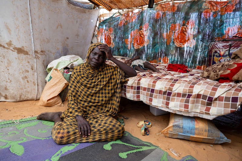 Thirty-four-year-old Sudanese refugee Halima Mahamat Abakar sits inside her shelter in the Adre refugee camp