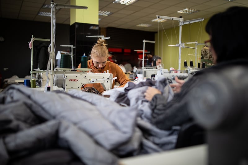 Women remove and repurpose the insulated lining of coats for home-made military bulletproof vests. Most of the material arrives from a market near Odesa or is donated.