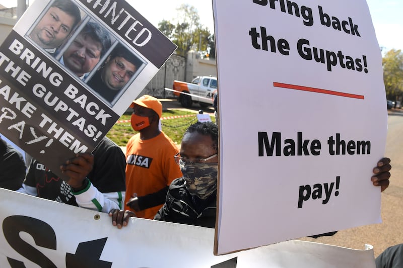 Last year, a group of people held protests in Pretoria, South Africa, calling for the Guptas to face justice. Getty Images