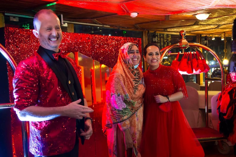 Dubai, United Arab Emirates - Richard the man behind the Big Ticket draw with Bouchra Yamani welcoming winners at the gathering of of Abu Dhabi Big Ticket winners at Alexandra Dhow Cruise, Dubai Marina.  Leslie Pableo for The National for Sarwat Nasir's story