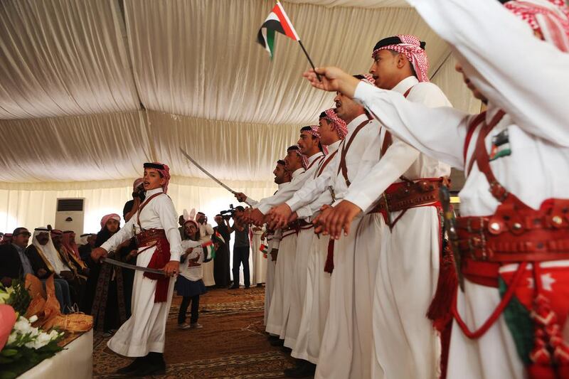 A traditional Jordanian folk group performs during a celebration of the ibex release on Thursday. The festivities marked the success of a project launched by Sheikh Mohammed Bin Zayed and the Environment Agency Abu Dhabi. Salah Malkawi for The National
