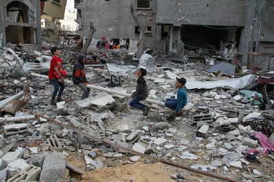 Palestinian children play in the rubble at a park destroyed during Israel's military offensive, during Eid, in Gaza City, on April 11. Reuters