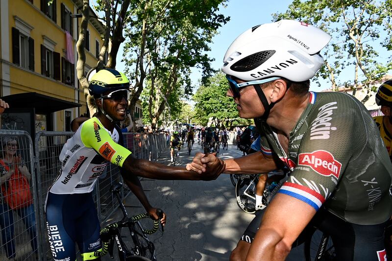 Dutch rider Mathieu van der Poel shakes hands with Biniam Girmay at the end of the of Stage 10. AP