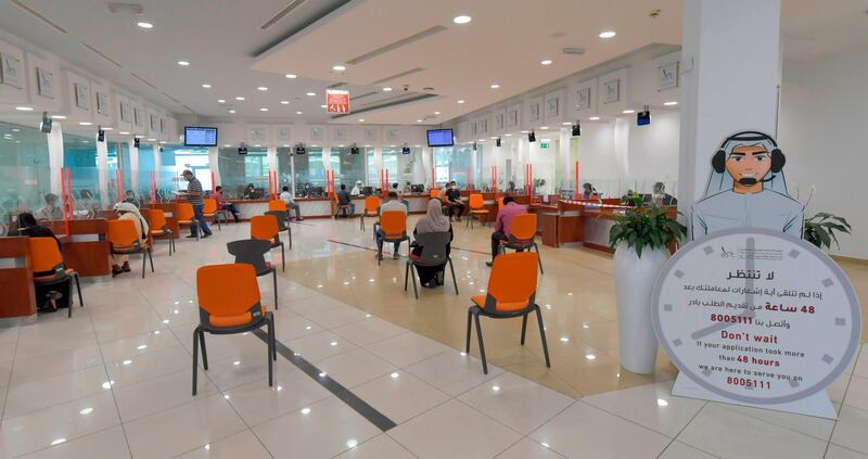 Chairs at the Passports Department are set up to adhere to social distancing as civil servants return to work following the easing of restrictions in Dubai.  AFP