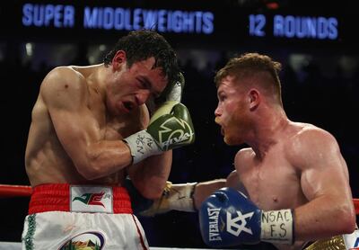 Saul 'Canelo' Alvarez, right, punches Julio Cesar Chavez Jr during their catchweight bout at T-Mobile Arena on May 6, 2017 in Las Vegas, Nevada. Canelo Alvarez won by unanimous decision. Al Bello / Getty Images