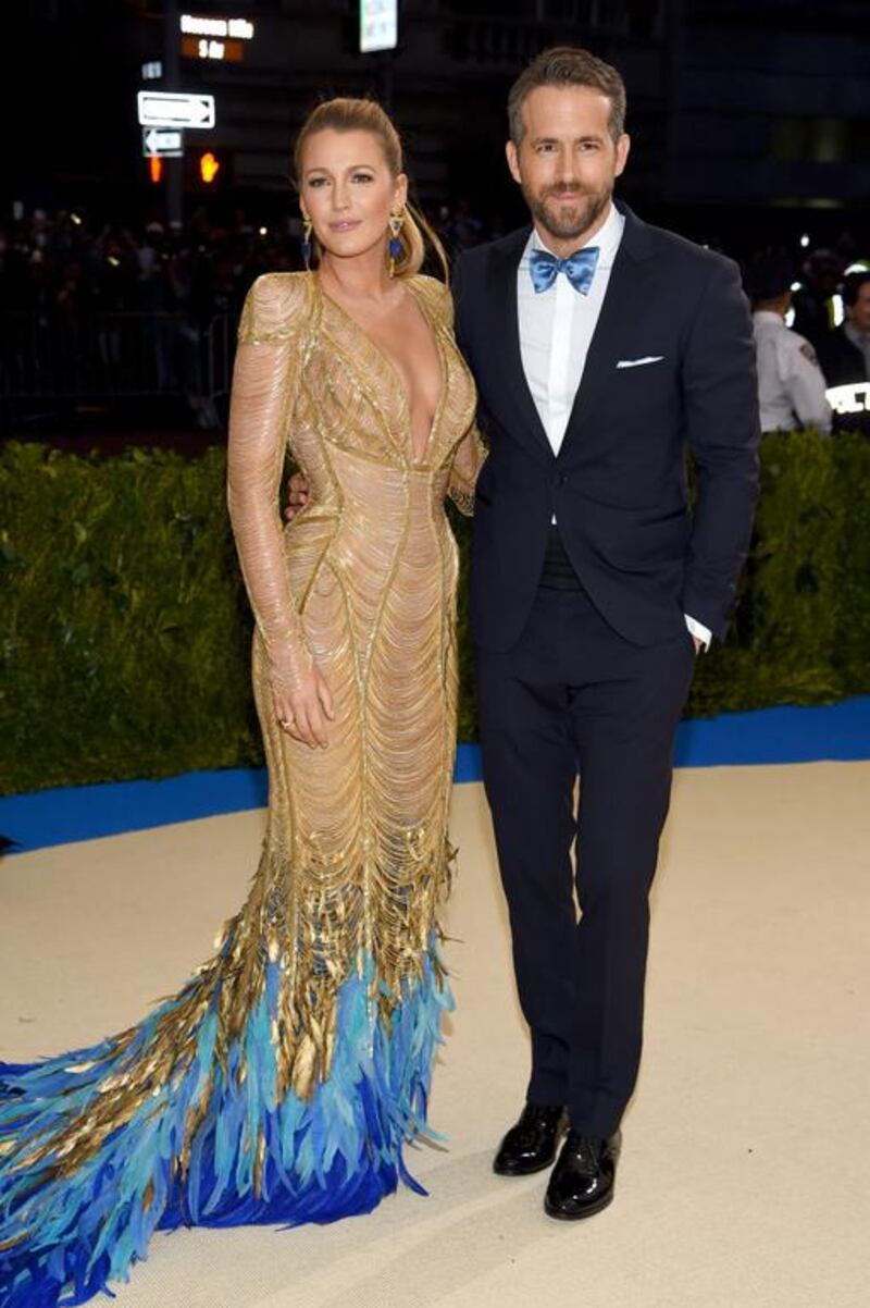 Blake Lively wears a custom-made Atelier Versace gown, while hubby Ryan Reynolds wears a navy blue Versace tuxedo. Courtesy of Versace