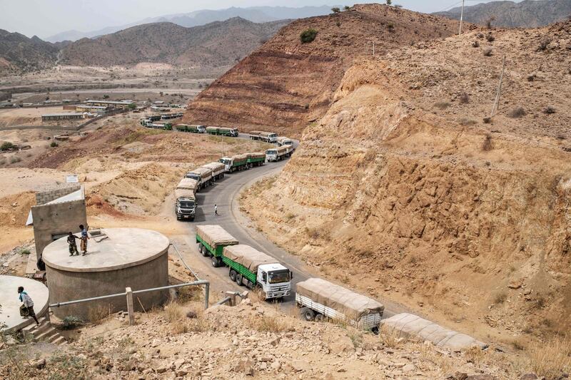 A convoy of trucks part of the World Food Programme (WFP) on their way to Tigray are seen in the village of Erebti, Ethiopia. The Afar region, the only passageway for humanitarian convoys bound for Tigray, is itself facing a serious food crisis, due to the combined effects of the conflict in northern Ethiopia and the drought in the Horn of Africa which have notably caused numerous population displacements.  More than a million people need food aid in the region according to the World Food Programme.  AFP