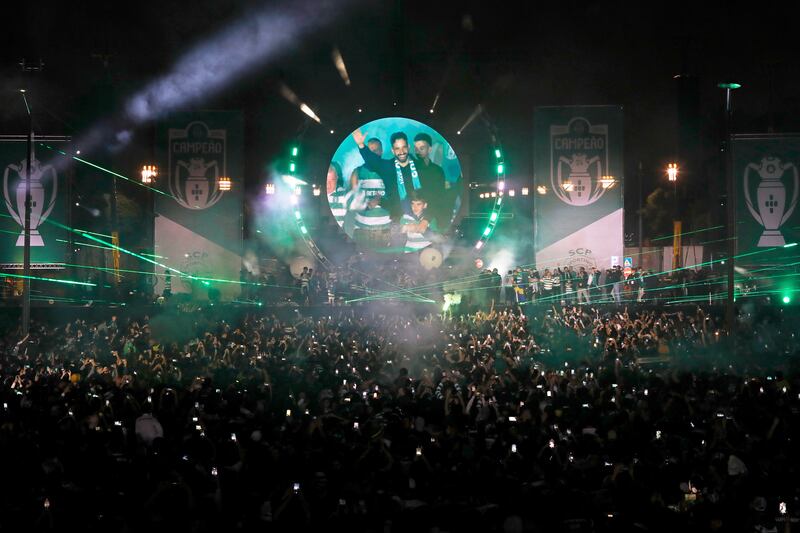 A video screen shows Sporting CP's manager Ruben Amorim celebrating with thousands of fans after winning the Portuguese football league, in Lisbon. AP