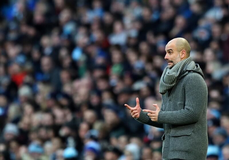 Pep Guardiola watches on from the touchline. AP Photo