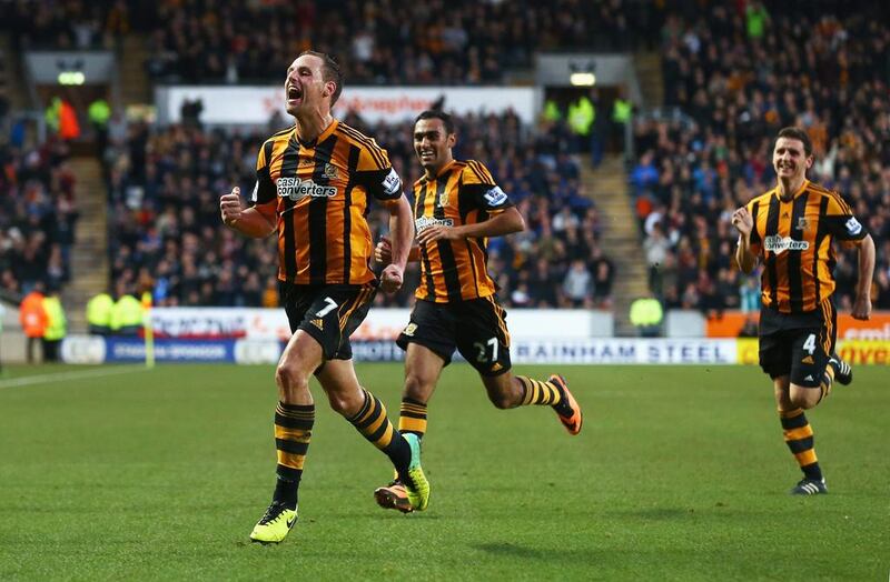 David Meyler, left, of Hull City celebrates scoring his team's second goal during a 3-1 win over Liverpool on Sunday. Matthew Lewis / Getty Images