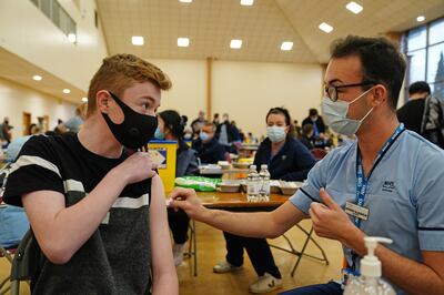 A 15-year-old boy receiving a Covid vaccine in Glasgow, Scotland, on Monday. PA