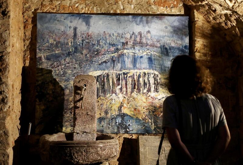 A visitor looks at an artwork by British artist Tom Young during at Arthaus Beirut, Lebanon. Reuters