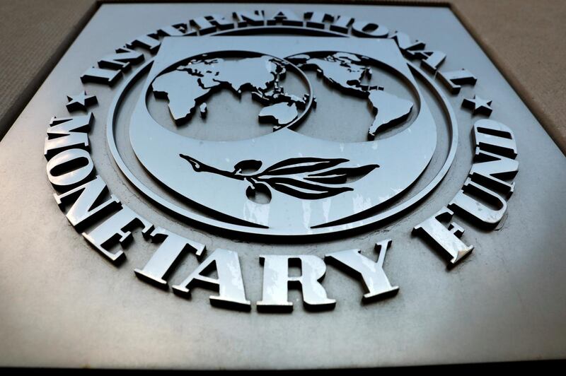 FILE PHOTO: The International Monetary Fund (IMF) logo is seen outside the headquarters building in Washington, U.S., as IMF Managing Director Christine Lagarde meets with Argentine Treasury Minister Nicolas Dujovne September 4, 2018. REUTERS/Yuri Gripas/File Photo