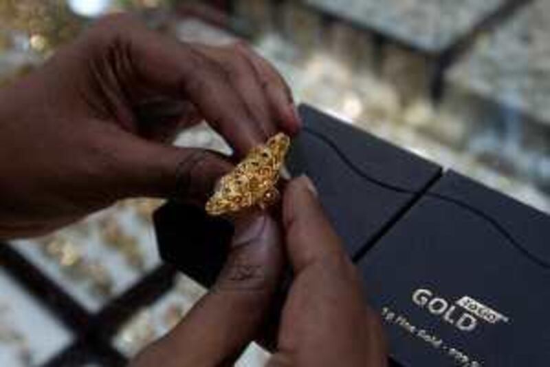 ABU DHABI, UNITED ARAB EMIRATES, May 17: Surya looking at the gold ring in exchange of 6 gm gold bar in one of the jewelry shop at Marina Mall in Abu Dhabi. (Pawan Singh / The National) For News. Story by Surya
