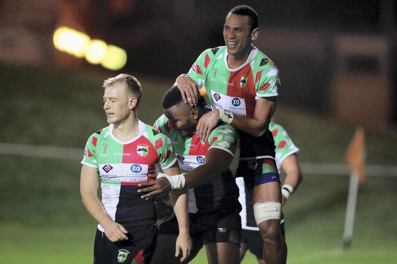 Abu Dhabi, United Arab Emirates - October 12, 2018: Quins' Emosi Vecanua scores in the game between Abu Dhabi Harlequins and Dubai Hurricanes in the West Asia Premiership. Friday, October 12th, 2018 at Zayed Sports City, Abu Dhabi. Chris Whiteoak / The National