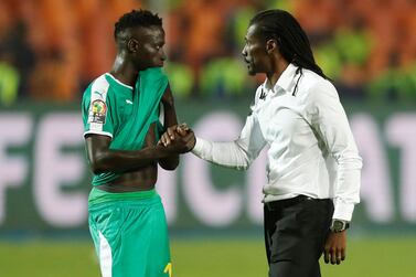 Senegal manager Aliou Cisse consoles Ismaila Sarr after their defeat to Egypt in the Afrcia Cup of Nations final. Reuters