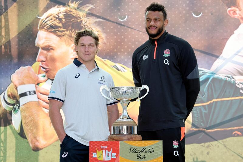 Australia captain Michael Hooper, left, and England captain Courtney Lawes pose for pictures with the Ella Mobbs trophy in Perth on July 1, 202. AFP