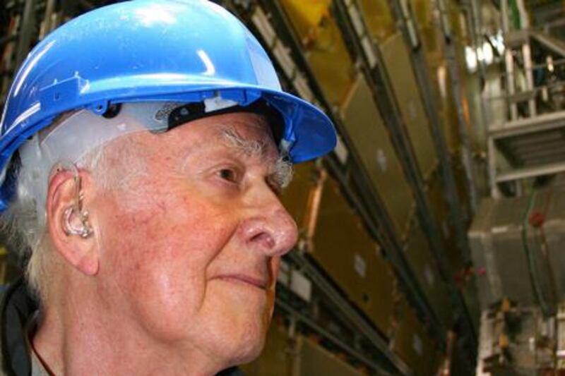 Emeritus professor at the University of Edinburgh, British Peter Higgs is seen with the ATLAS Experiment as background during his visit to the European Organization for Nuclear Research (CERN), on April 5, 2008 in Geneva. Higgs is best known for his theory explaining the origin of mass of elementary particles in general and the Higgs Boson in particular. CERN is expected to put into service in the summer 2008 the massive Large Hadron Collider (LHC), the largest scientific instrument ever made which will determine the existence of the Higgs Boson.   AFP PHOTO / POOL / University Of Edinburgh/Peter Reid