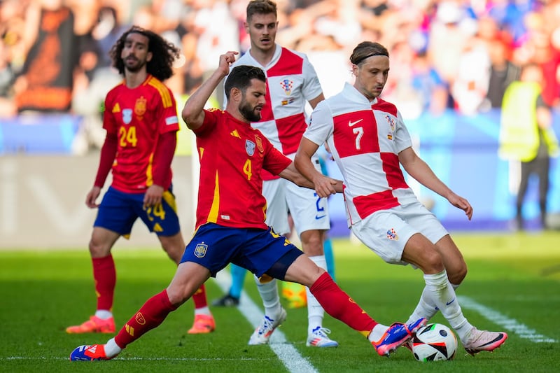 Spain defender Nacho challenges Croatia's Lovro Majer during the Euro 2024 group-stage match in Berlin on June 15, 2024. AP