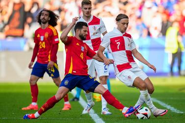Croatia's Lovro Majer, right, fights for the ball with Spain's Nacho during a Group B match between Spain and Croatia at the Euro 2024 soccer tournament in Berlin, Germany, Saturday, June 15, 2024.  (AP Photo / Manu Fernandez)