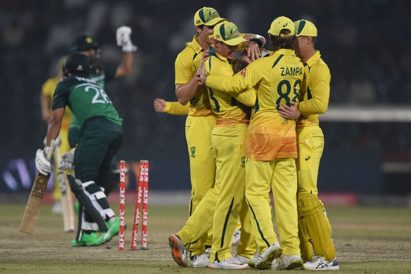 Australia's players celebrate after the dismissal of Pakistan's Imam-ul-Haq. AFP