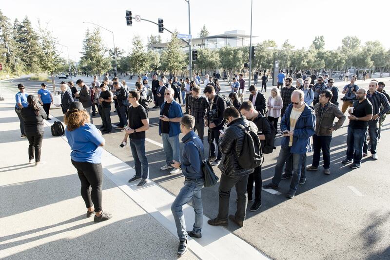 Attendees line up for check-in ahead of the Apple event. Bloomberg