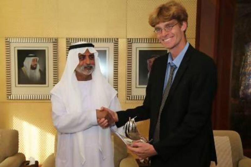 Sheikh Nahyan bin Mubarak, Minister for Culture, Youth and Community Development presents the annual natural history award to Oscar Campbell , a teacher at the British School Al Khubairat and bird conservationist, at his majlis in Abu Dhabi.  Pawan Singh / The National