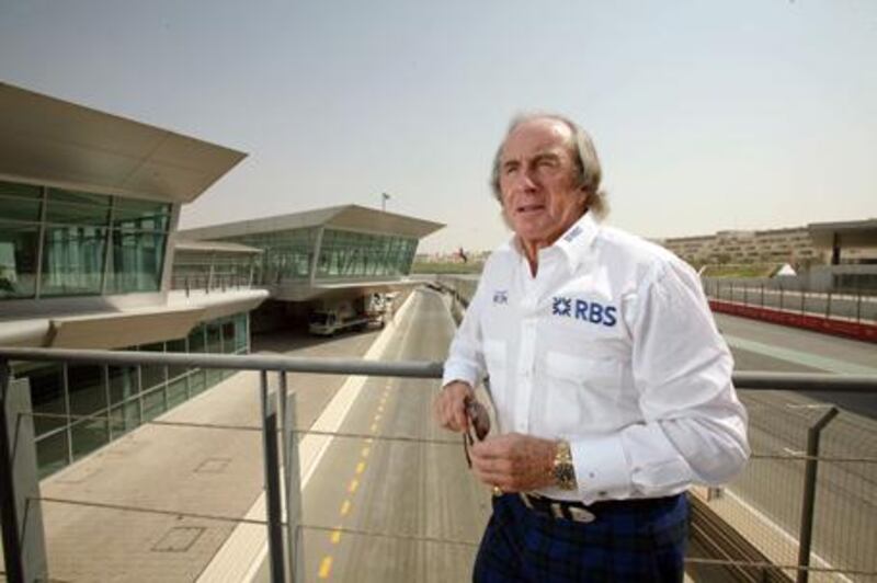 Sir Jackie Stewart shows off his unique sartorial elegance at Dubai Autodrome before reflecting on the dangerous days of F1 racing.