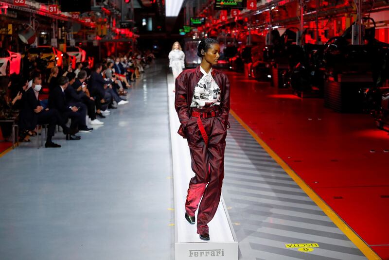 A model walks the runway at the fashion debut of the first co-ed Ferrari collection at Ferrari Factory on June 13, 2021 in Maranello, Italy. Reuters