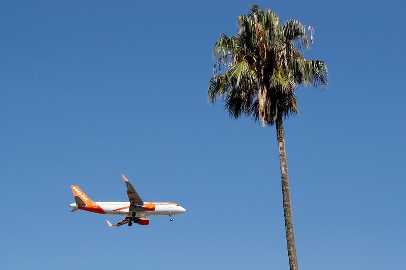 FILE - In this Aug. 21, 2019 file photo, an easyJet airplane approaches Lisbon airport for landing. Leaders from Britain's aviation industry joined forces Wednesday April 14, 2021, to urge the British government to ensure that popular European destinations face the least onerous coronavirus travel restrictions when holidays are allowed again. (AP Photo/Armando Franca, File)
