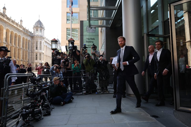 Prince Harry and his lawyer David Sherborne (R) leave the High Court in central London, where the duke was being cross-examined in a ‘press invasion’ trial. AFP