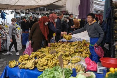 epa09089823 People shopping at local bazaar in Istanbul, Turkey, 22 March 2021. Turkey's currency lost nearly 15% after President Recep Tayyip Erdogan sacked the country's central bank governor at the weekend. The Turkish lira fell to 8,48 Liras against the US dollar.  EPA/SEDAT SUNA