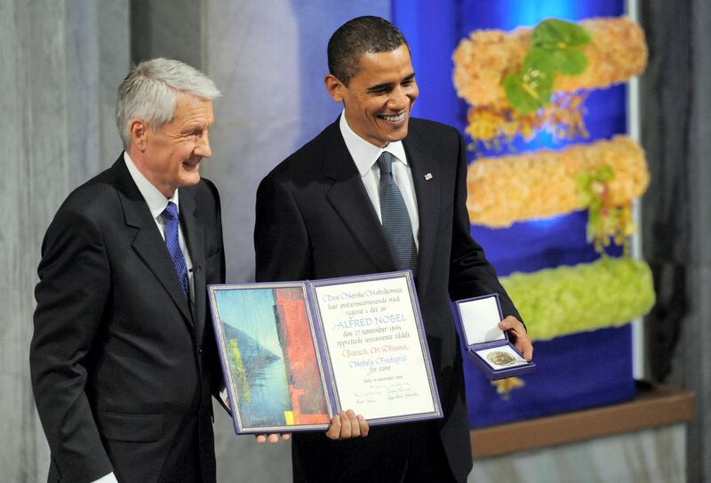 US President Barack Obama (R) holds his Nobel Peace Prize next to Chairman of the Norwegian Nobel Committee, Thorbjoern Jagland, during the Nobel Peace Prize Ceremony at the Oslo City Hall in Oslo on December 10, 2009. Nobel Peace Prize laureate, US President Barack Obama faces a tricky task of reconciling the revered honor with his decision just last week to send 30,000 troops to escalate the war in Afghanistan, a move which tripled the US force there since he took office.     AFP PHOTO/Jewel SAMAD / AFP PHOTO / JEWEL SAMAD