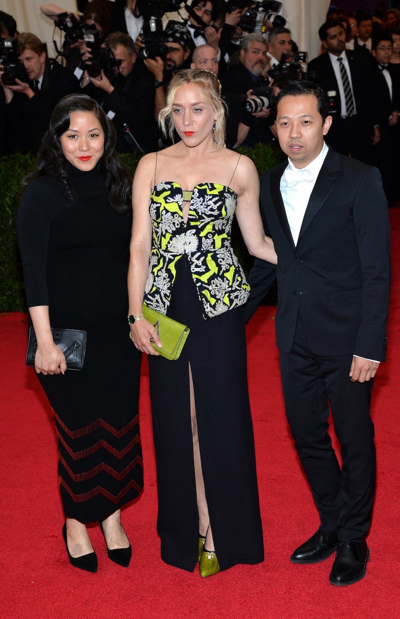 epa04196585 Kenzo creative directors Humberto Leon (R) and Carol Lim (L) arrive with US actress Chloe Sevigny (C) for the 2014 Anna Wintour Costume Center Gala held at the New York Metropolitan Museum of Art in New York, New York, USA, 05 May 2014. The Costume Institute's new Anna Wintour Costume Center opens on 08 May with the exhibition 'Charles James: Beyond Fashion.'  EPA/JUSTIN LANE