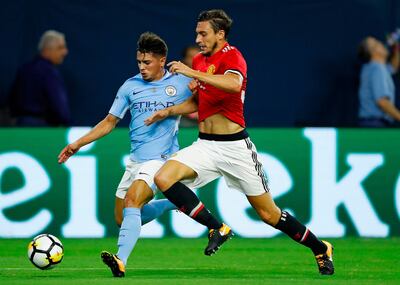 Manchester City defender Brahim Diaz (L) and Manchester United defender Matteo Darmian (R) vie for the ball during the International Champions Cup soccer match at NRG Stadium on July 20, 2017 in Houston, Texas. Manchester United won 2-0. / AFP PHOTO / AARON M. SPRECHER