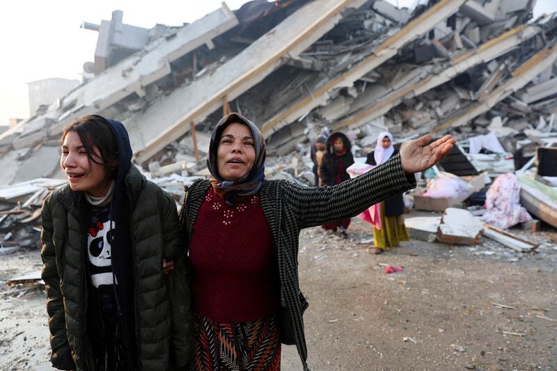 Women grieve in Hatay, Turkey. Reuters