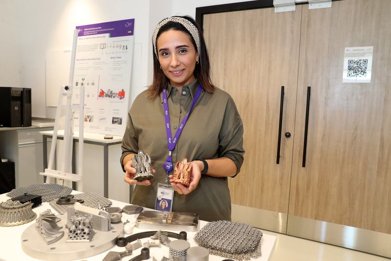 Nesma Aboulkhair, director of additive manufacturing, shows 3D-printed items inside the lab at the Technology Innovation Institute in Abu Dhabi