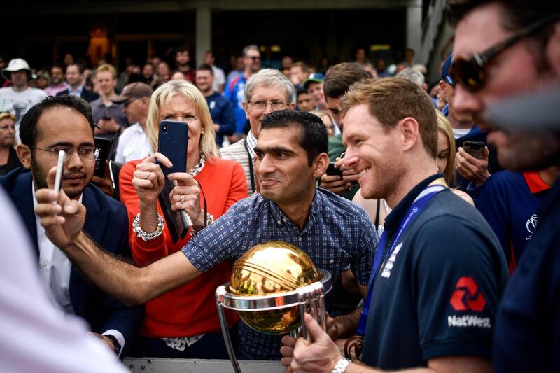 A fan takes a selfie with Eoin Morgan, Captain, during the England ICC World Cup Victory Celebration at The Kia Oval in London, England. Getty Images