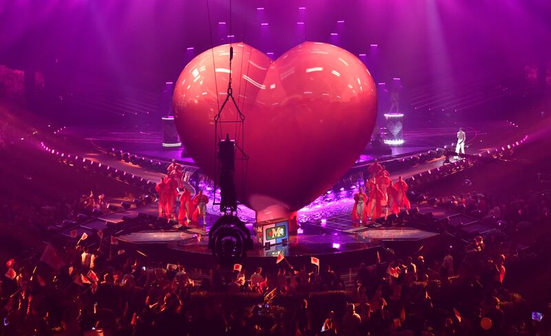 Mika performing to a spectacular backdrop. Getty Images