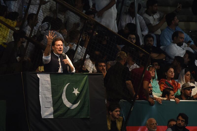 Mr Khan addressing a rally in Lahore. AFP