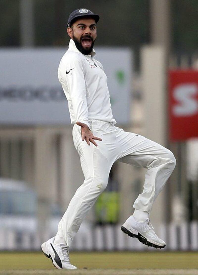 India's captain Virat Kohli gestures towards Australia's Matt Renshaw as he runs to celebrate the dismissal of David Warner during the fourth day of their third test cricket match in Ranchi, India, Sunday, March 19, 2017. Aijaz Rahi / AP Photo