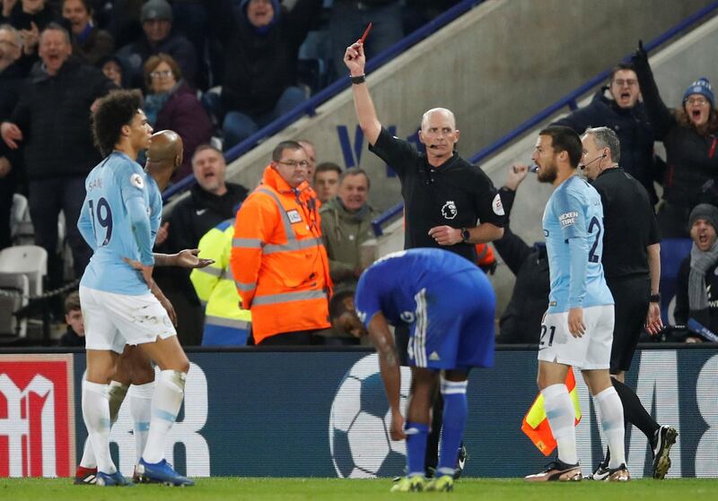Manchester City's Fabian Delph is shown a red card by referee Mike Dean. Action Images via Reuters