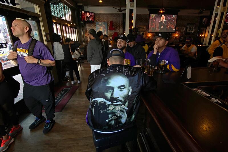A patron wears a 'Kobe' jacket  in Los Angeles as mourners arrive for 'A Celebration of Life' for Kobe and Gianna Bryant at the Staples Center. EPA