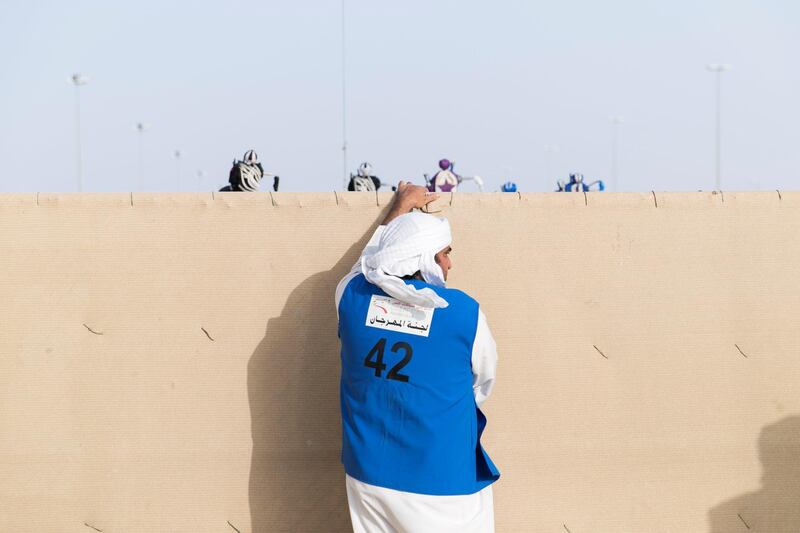 DUBAI, UNITED ARAB EMIRATES - Feb 15, 2018.

A man closes the gate at the start line of Al Marmoum Race Track.

The fastest camels in the Gulf will compete for cash, swords, rifles and luxury vehicles totalling Dh95 million at the first annual Sheikh Hamdan Bin Mohammed Bin Rashid Al Maktoum Camel Race Festival in Dubai.


(Photo: Reem Mohammed/ The National)

Reporter:
Section: NA