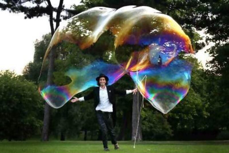 'You can never get bored of bubbles,' says Samsam Bubbleman, seen here with the record-breaking free-floating bubble he created in 2009. Courtesy SamSam Bubbleman