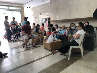 Residents of Zen Tower taking shelter in Manchester Tower after being evacuated after the Zen Tower fire. Leslie Pableo for The National