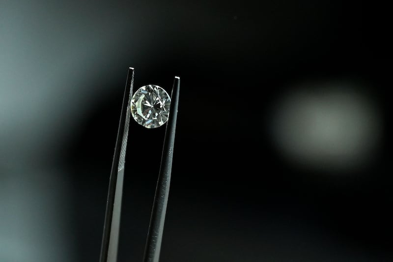 A diamond is displayed at a factory in Surat, India. AFP