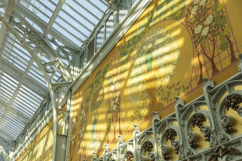 Sunlight illuminates art nouveau frescos in the main atrium inside the Samaritaine department store, operated by LVMH Moet Hennessy Louis Vuitton, during ongoing renovation work in Paris, France, on Tuesday, Nov. 19, 2019. The world’s biggest luxury group LVMH, controlled by billionaire Bernard Arnault--is set to reopen the Samaritaine department store next April after 15 years. Photographer: Laura Stevens/Bloomberg