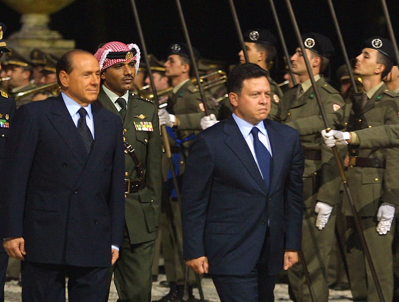 Mr Berlusconi welcomes Jordan's King Abdullah in Rome in October 2001.  AFP